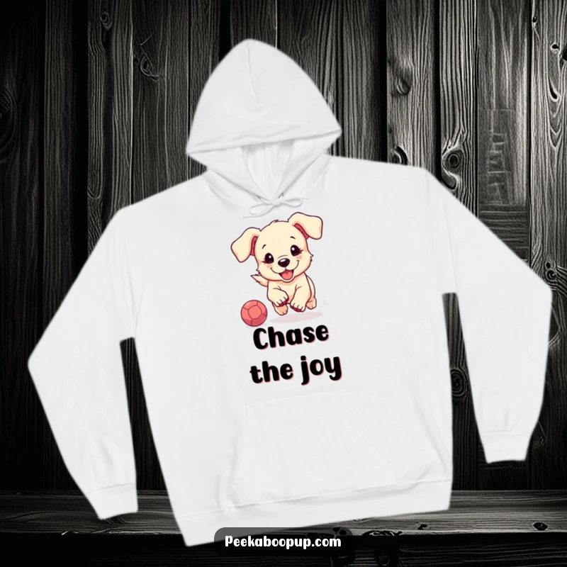 Funny and warm hoodie featuring a cute puppy with floppy ears enthusiastically chasing a bouncing ball, perfect for dog lovers.