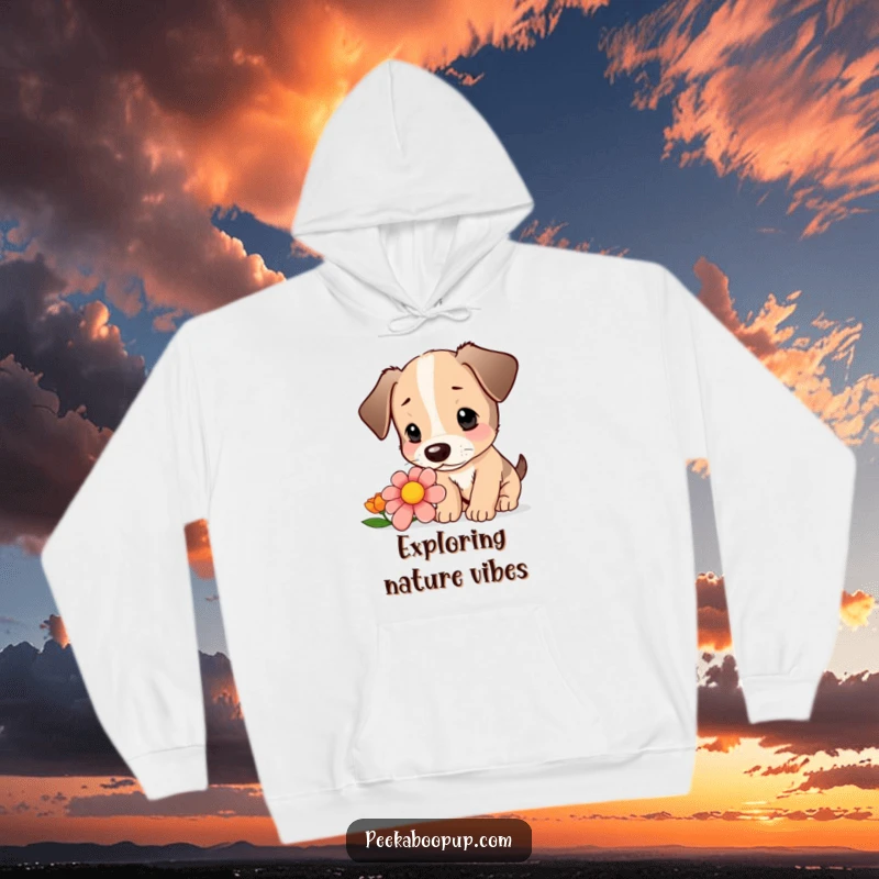 Funny hoodie with a design of a cute puppy curiously sniffing a colorful flower with focused intrigue.