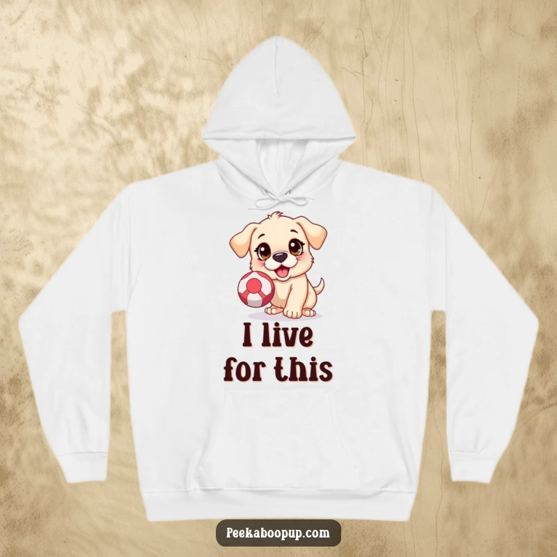Funny hoodie featuring an excited puppy with wide, eager eyes, jumping to catch a bouncing ball, illustrating pure playfulness.