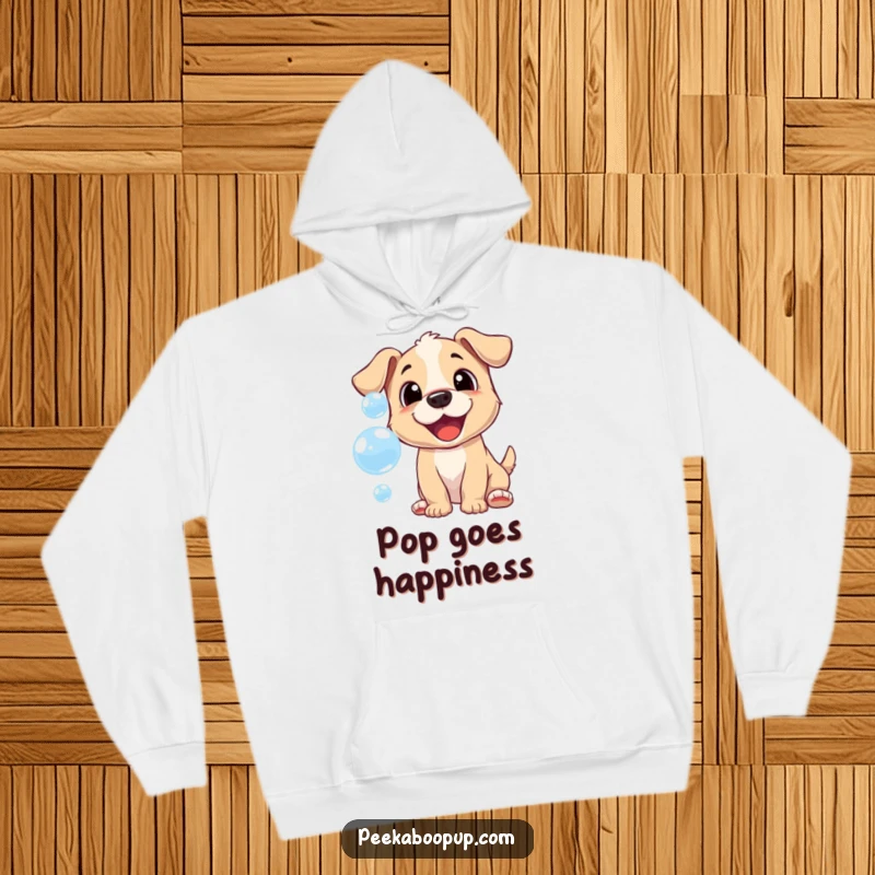 Funny hoodie with a cheerful puppy playfully trying to catch iridescent bubbles, embodying pure joy.
