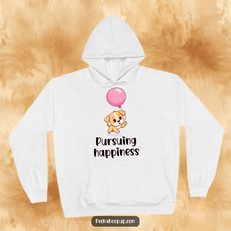 Funny hoodie featuring a puppy with determined eyes chasing a deflating balloon, perfect for staying warm while embracing perseverance.