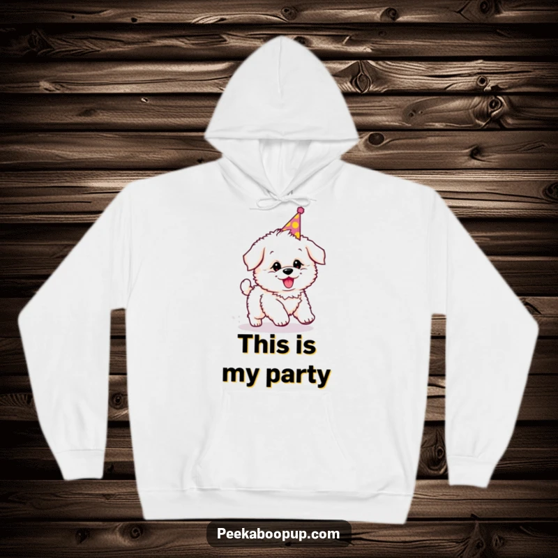 Funny hoodie with a fluffy puppy wearing a party hat, comically chasing its tail, embodying pure joy.