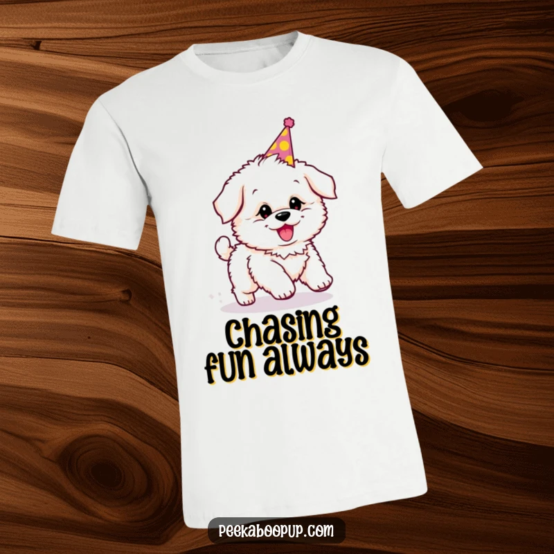 Funny t-shirt featuring a fluffy puppy in a party hat, spinning around chasing its tail with joyful abandon.
