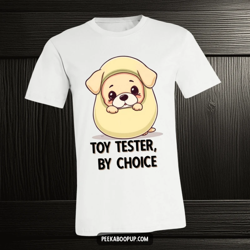 Funny t-shirt featuring an adorable puppy with ears perked, peeking mischievously from behind a comically large squeaky toy.