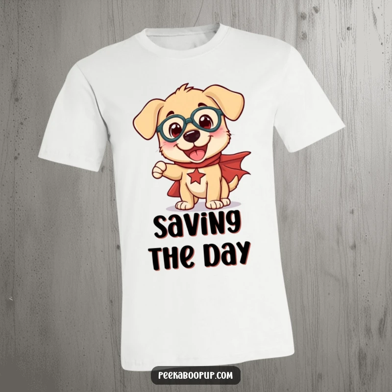 Funny t-shirt featuring a joyful puppy in a flowing cape, striking a goofy, exaggerated superhero pose.