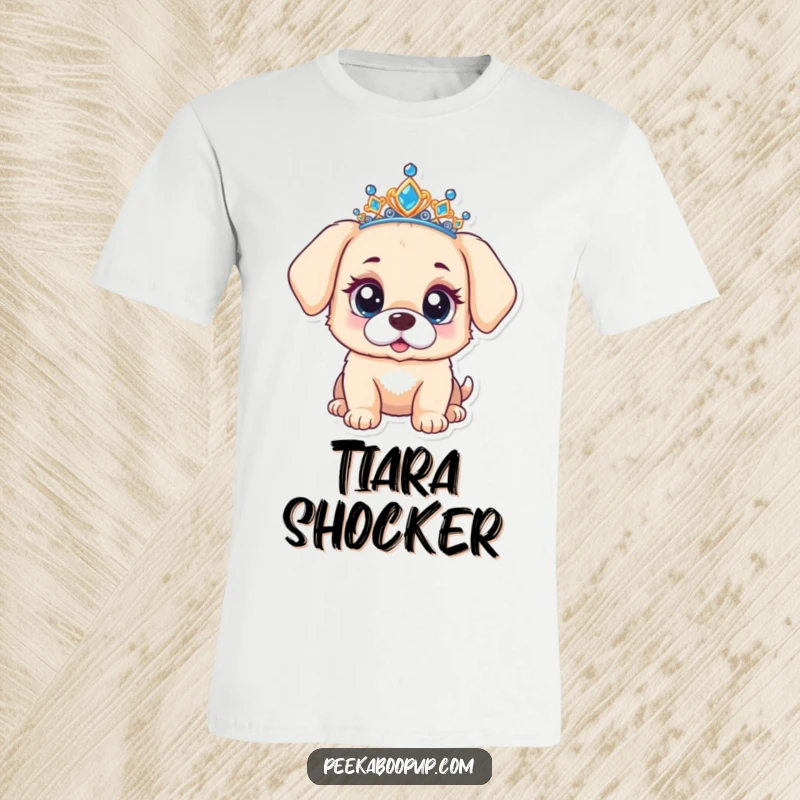Funny t-shirt depicting a puppy wearing a tiara, with a look of utter surprise and wide, curious eyes.