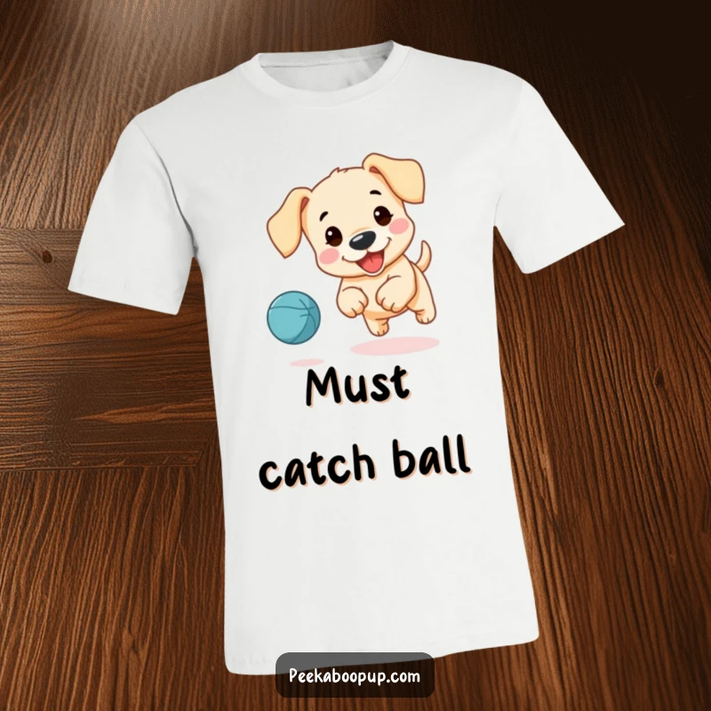 Funny t-shirt print of a cute puppy with long, floppy ears happily chasing a bouncing ball.