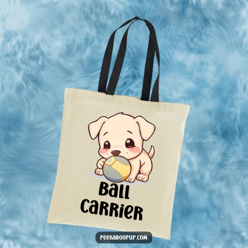 Funny tote bag featuring a playful puppy nudging a ball with its nose, perfect for carrying essentials with a smile.
